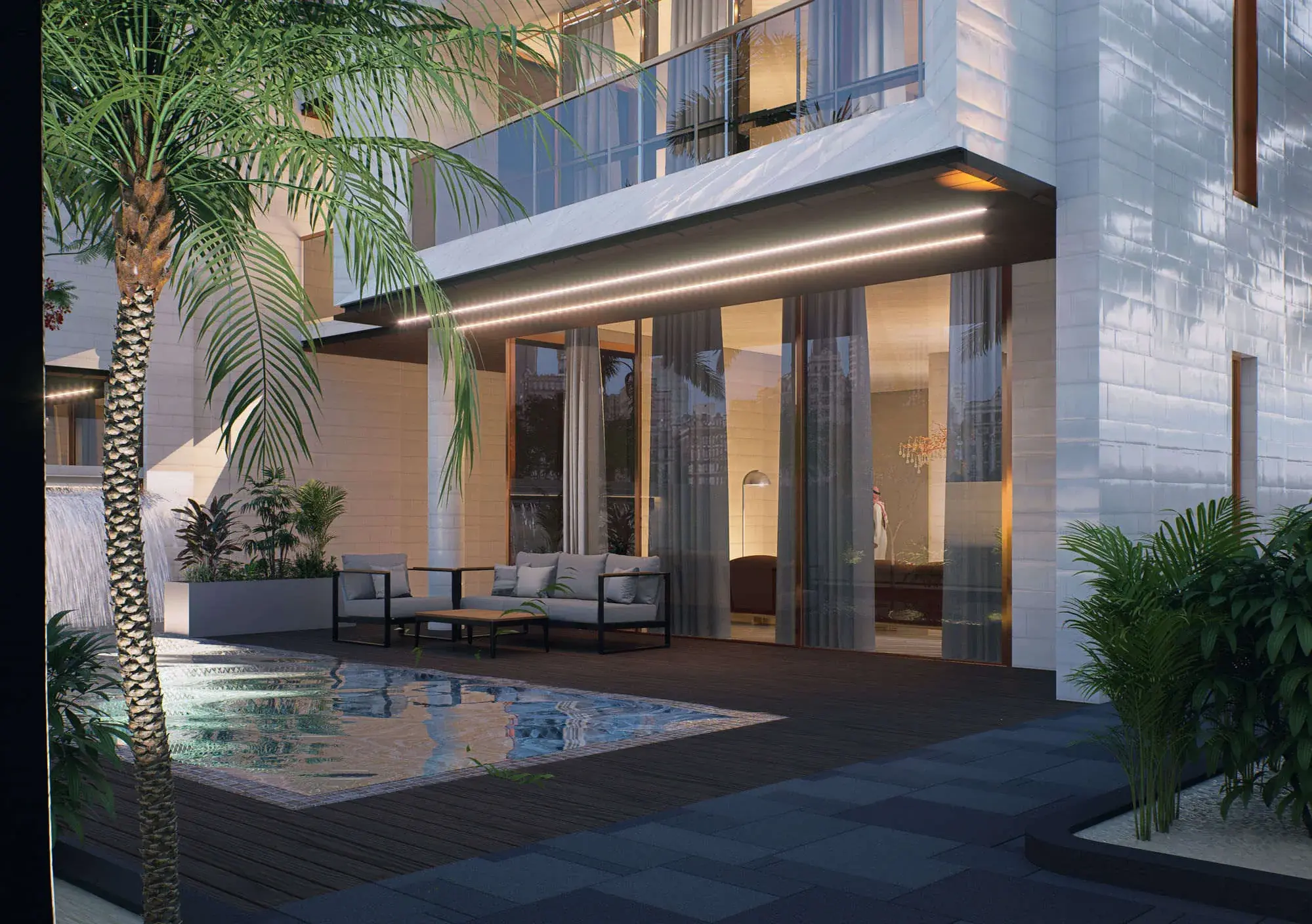 Covered terrace at dusk, a continuous LED strip washing the soffit above full-height sliding glazing, with a plunge pool, timber deck and outdoor seating beneath a date palm.