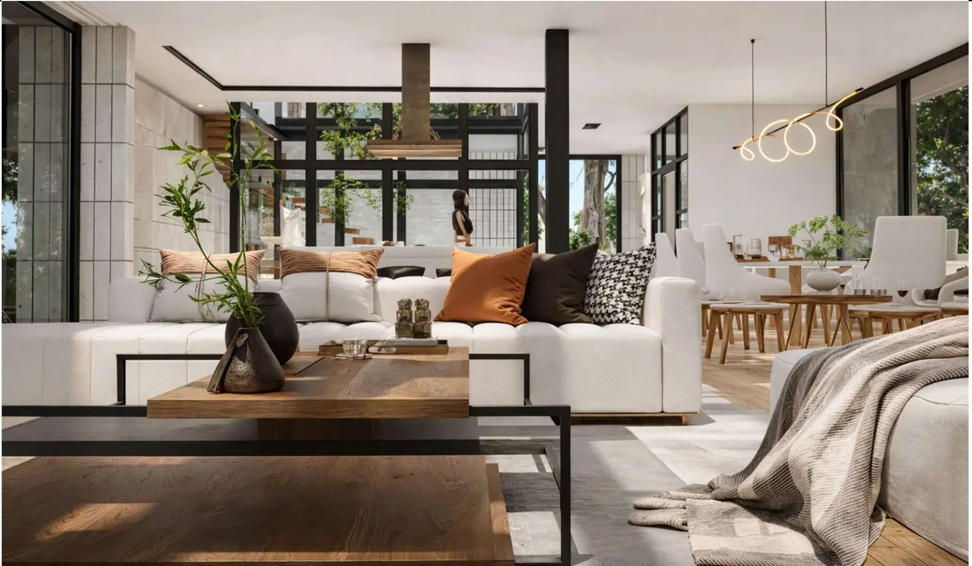 Living room with a deep pale sofa, layered timber coffee tables, a sculptural light and steel-framed glazing opening onto the courtyard.